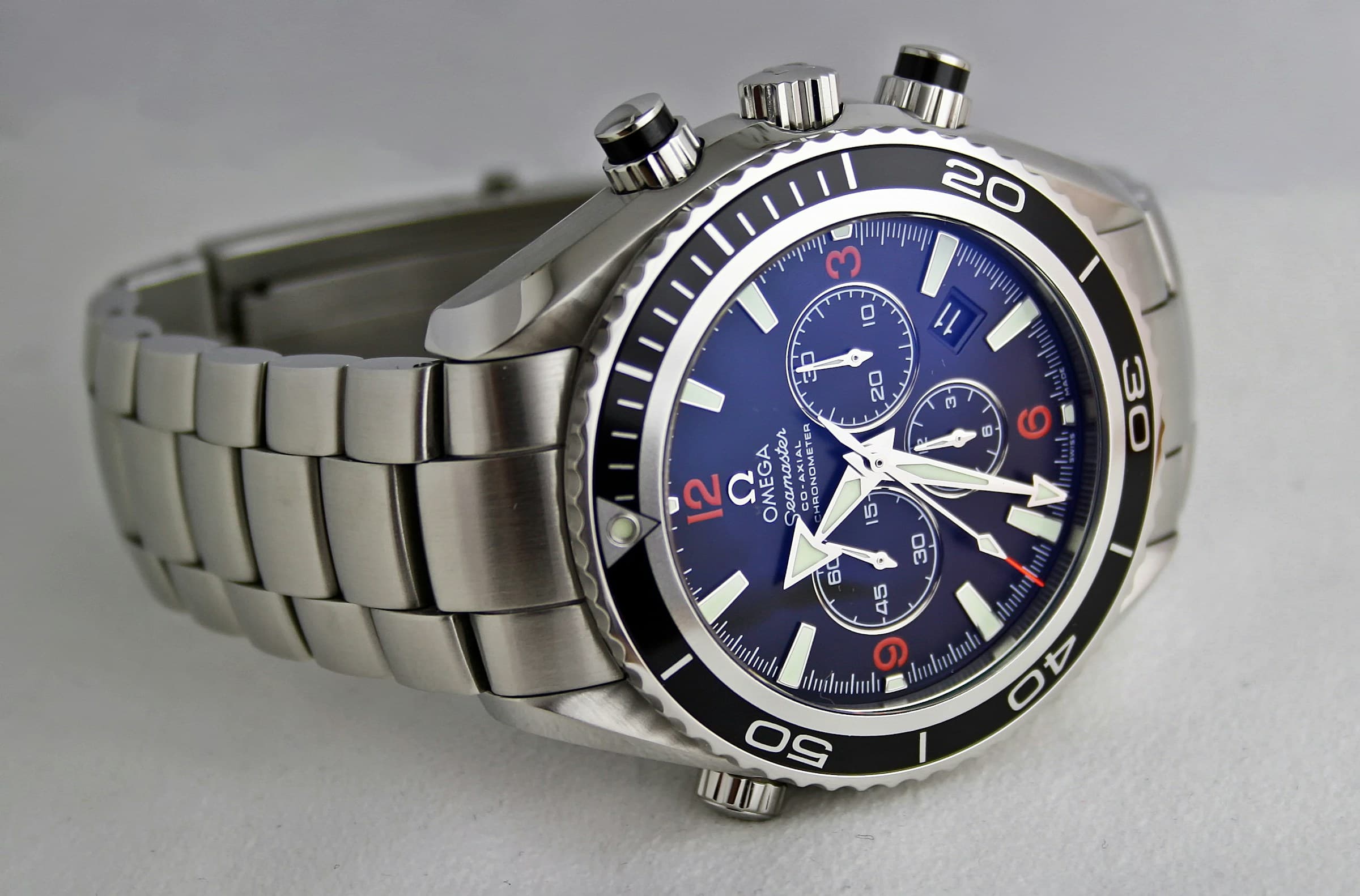 Luxury wristwatch on a dark surface