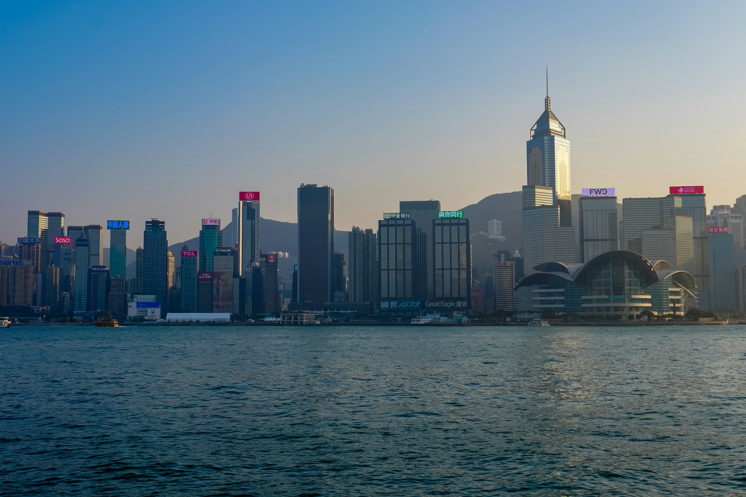Victoria Harbour and Hong Kong skyline at sunset