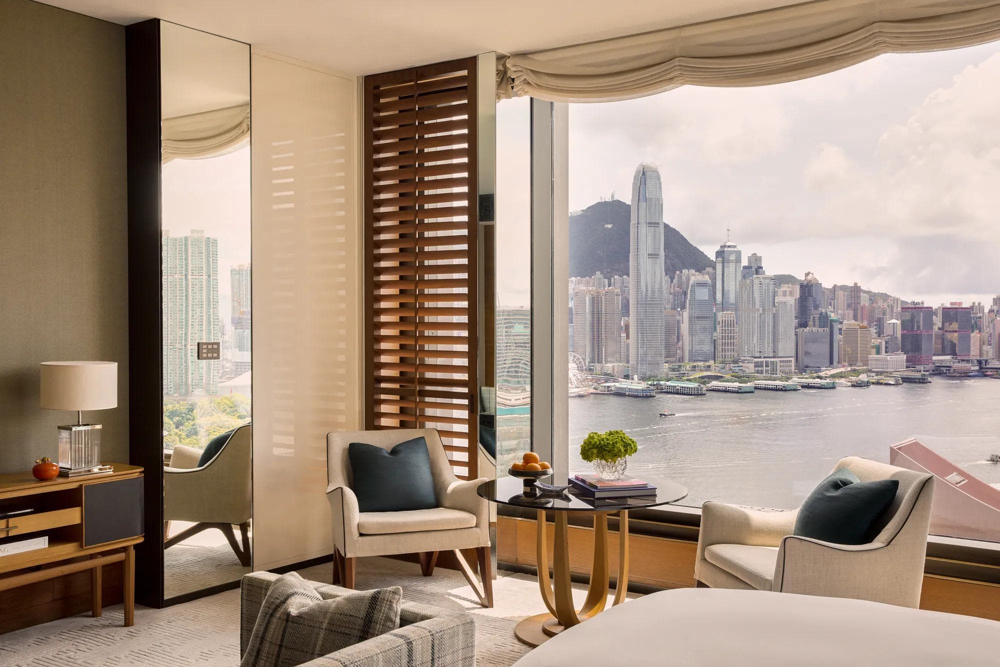 Residential seating area in a Rosewood Hong Kong harbour-view room overlooking Victoria Harbour and Central