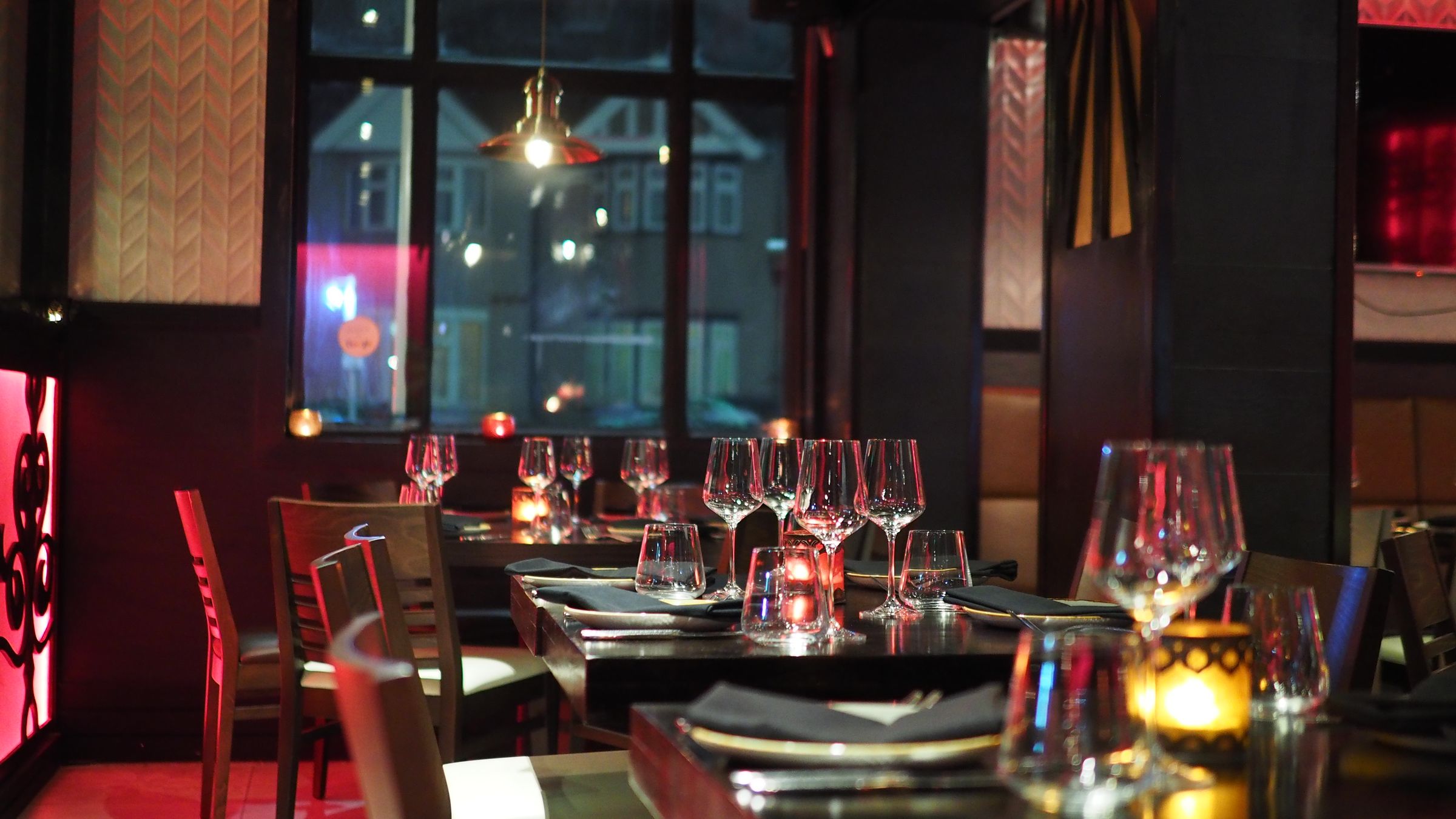 Plated tasting courses on a white tablecloth