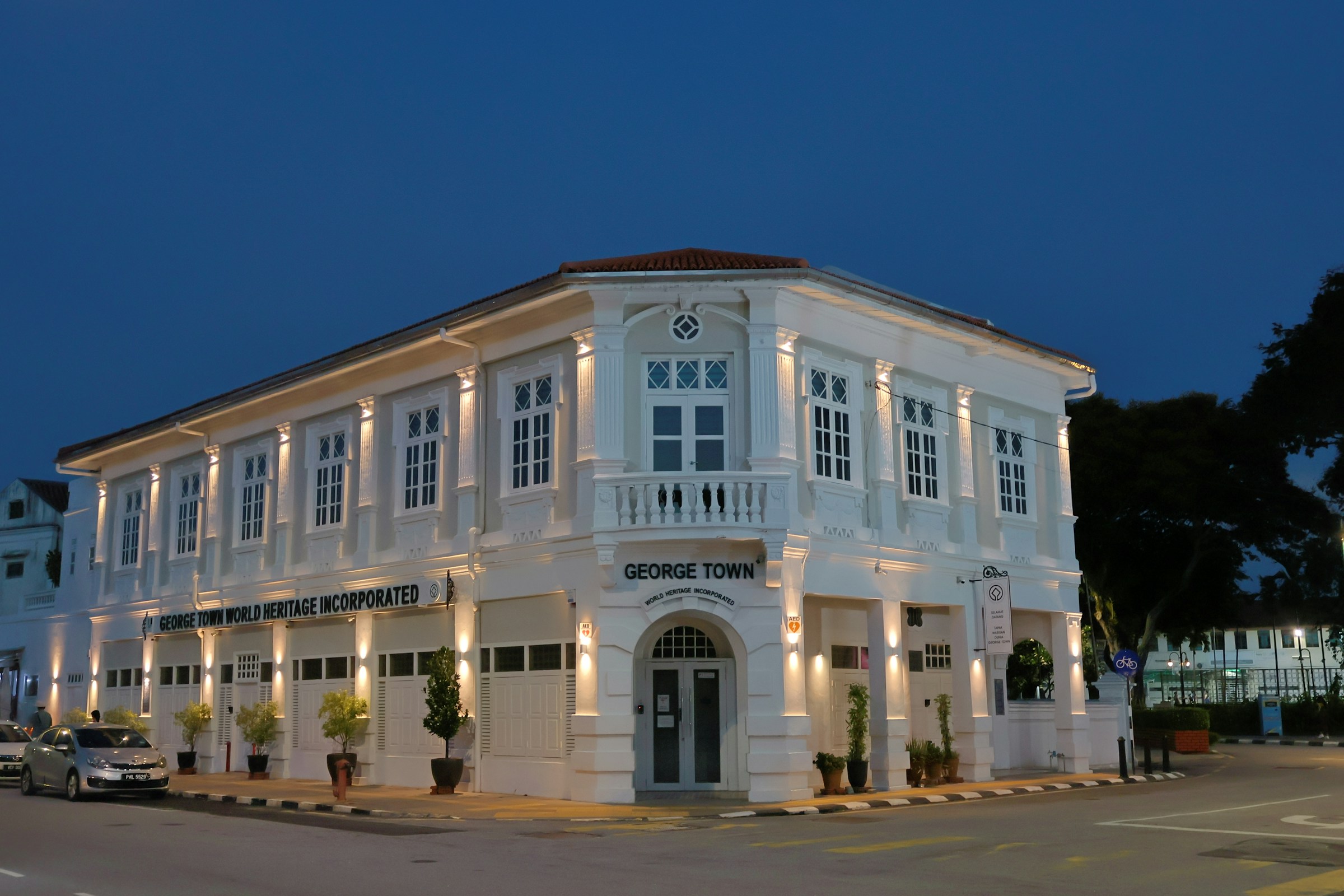 Colonial heritage building illuminated at dusk in George Town